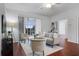 Living room with hardwood floors, sliding glass doors and comfortable seating at 4351 Hammersmith Dr, Clermont, FL 34711