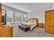 Comfortable bedroom with natural light, neutral walls, and carpeted floors at 504 Narrow View Ln, Groveland, FL 34736