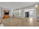 Spacious living room featuring tile floors, ample natural light, and an open layout at 504 Narrow View Ln, Groveland, FL 34736