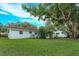 Spacious backyard with mature trees and lush grass at 530 Mar Nan Mar Place, Clermont, FL 34711