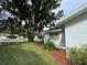 House exterior showcasing landscaping and canal view at 530 Mar Nan Mar Place, Clermont, FL 34711