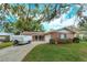 Brick ranch home with large tree and yard at 530 Mar Nan Mar Place, Clermont, FL 34711