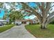 Brick ranch home with a large tree and spacious yard at 530 Mar Nan Mar Place, Clermont, FL 34711