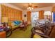 Relaxing Gathering room with vintage furniture and green carpet at 530 Mar Nan Mar Place, Clermont, FL 34711