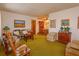 Spacious living room with vintage furniture and green carpet at 530 Mar Nan Mar Place, Clermont, FL 34711