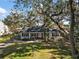 Ranch style home with mature trees and a large front yard at 734 Boylston St, Leesburg, FL 34748