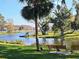 Serene lakeside park with benches and lush greenery at 734 Boylston St, Leesburg, FL 34748