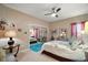 Guest bedroom with a queen-size bed and mirrored closet doors at 9033 Saint Andrews Way, Mount Dora, FL 32757