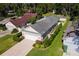 Picture perfect view of this charming single-story home with 2 car garage and driveway compass at 973 Belle Oak Dr, Leesburg, FL 34748