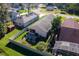 Aerial view of the home highlighting the fenced backyard and neighborhood at 973 Belle Oak Dr, Leesburg, FL 34748