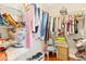Spacious walk-in closet with shelving and clothing racks for optimal storage and organization at 973 Belle Oak Dr, Leesburg, FL 34748