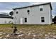 The home has a backyard and simple vinyl siding at 209 Hyacinth Ct, Kissimmee, FL 34759