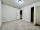 This bedroom offers a closet and neutral walls with carpeted floors at 209 Hyacinth Ct, Kissimmee, FL 34759