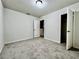 Neutral bedroom with plush carpeting, closet, overhead light and ample natural light at 209 Hyacinth Ct, Kissimmee, FL 34759