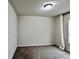 This bedroom features neutral paint, carpeted floors, and a light fixture at 209 Hyacinth Ct, Kissimmee, FL 34759