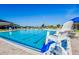 Resort-style community pool offers a refreshing escape with ample seating and clear blue water at 209 Hyacinth Ct, Kissimmee, FL 34759