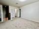 Bright upstairs hallway featuring carpet flooring, white doors, and neutral walls at 209 Hyacinth Ct, Kissimmee, FL 34759
