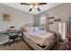 Bright bedroom with a comfortable bed, window coverings and a keyboard at 2560 Abey Blanco Dr, Orlando, FL 32828