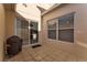 Private patio with tile flooring, sliding glass door, and grill at 2560 Abey Blanco Dr, Orlando, FL 32828