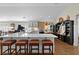 Bright kitchen island with bar stool seating and views of the kitchen with stainless appliances at 3469 Melbourne Ln, The Villages, FL 32163