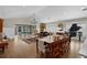 Spacious living room featuring hardwood floors, elegant furnishings, and a grand piano at 3469 Melbourne Ln, The Villages, FL 32163