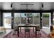 Outdoor view from sun room featuring an elegant stone wall, outdoor furniture, and manicured landscaping at 3469 Melbourne Ln, The Villages, FL 32163