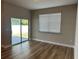 Living room with sliding glass doors and hardwood floors at 733 Prado Grande Ave, Haines City, FL 33844