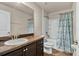 Bathroom featuring neutral countertop, updated fixtures, and a tub with shower at 8 Diamond Club Rd, Ocala, FL 34472
