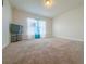 Spacious bedroom with neutral carpet, a large window, and ample natural light at 8 Diamond Club Rd, Ocala, FL 34472