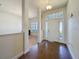 Bright foyer featuring a decorative front door with sidelights and tiled flooring at 8 Diamond Club Rd, Ocala, FL 34472
