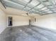 A spacious two-car garage with an attached water heater at 8 Diamond Club Rd, Ocala, FL 34472