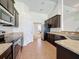 Well-equipped kitchen with stainless steel appliances and a view of the breakfast area at 8 Diamond Club Rd, Ocala, FL 34472