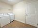 Functional laundry room with tile floors, washer, dryer and wire shelving at 8 Diamond Club Rd, Ocala, FL 34472