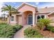 House front entrance with blue door and walkway at 917 Hawk Lndg, Fruitland Park, FL 34731