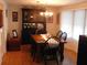 Elegant dining area featuring a beautiful table setting and ample room for entertaining at 117 Hibiscus Way, Leesburg, FL 34748