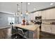 Modern kitchen with granite countertops and white cabinets at 1270 Stratton Ave, Groveland, FL 34736