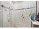 Clean shower with white tile and glass enclosure at 1270 Stratton Ave, Groveland, FL 34736