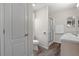 Neutral bathroom with a glass-enclosed shower, toilet and modern vanity at 1313 La Estrellita Way, The Villages, FL 32162