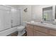 Bathroom features a shower, toilet and a stylish vanity at 1313 La Estrellita Way, The Villages, FL 32162