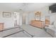 Main bedroom featuring carpeted floor and ensuite bathroom with walk-in closet at 1313 La Estrellita Way, The Villages, FL 32162