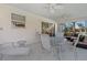 Enclosed patio with tile flooring, ceiling fans and outdoor seating at 1313 La Estrellita Way, The Villages, FL 32162