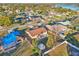 Aerial view of a single Gathering home in a neighborhood with a large lake and mature trees at 1907 E Chapel Dr, Deltona, FL 32738