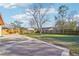 A spacious, grassy backyard with a concrete patio and a wooden fence, perfect for outdoor activities at 1907 E Chapel Dr, Deltona, FL 32738