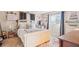 Bedroom featuring a white wooden bed frame, soft lighting, a makeup desk and decorative accents at 1907 E Chapel Dr, Deltona, FL 32738