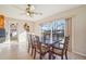 Dining room featuring tile flooring, neutral walls, decorative plates, and a large window at 1907 E Chapel Dr, Deltona, FL 32738