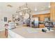 Kitchen with stainless steel appliances, wooden cabinets, and a large counterspace with seating at 1907 E Chapel Dr, Deltona, FL 32738