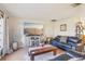 Comfortable living room with tile floors, two black sofas, and a decorative wooden coffee table at 1907 E Chapel Dr, Deltona, FL 32738