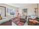 Inviting living room with a flat-screen TV, neutral-toned furniture, and plenty of natural light from the windows at 1907 E Chapel Dr, Deltona, FL 32738