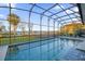 Inviting pool with screened enclosure offering lake views at 30303 Island Club Dr, Tavares, FL 32778