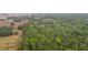 Aerial view of property showing large lot and surrounding trees at 34620 Galla Rd, Fruitland Park, FL 34731